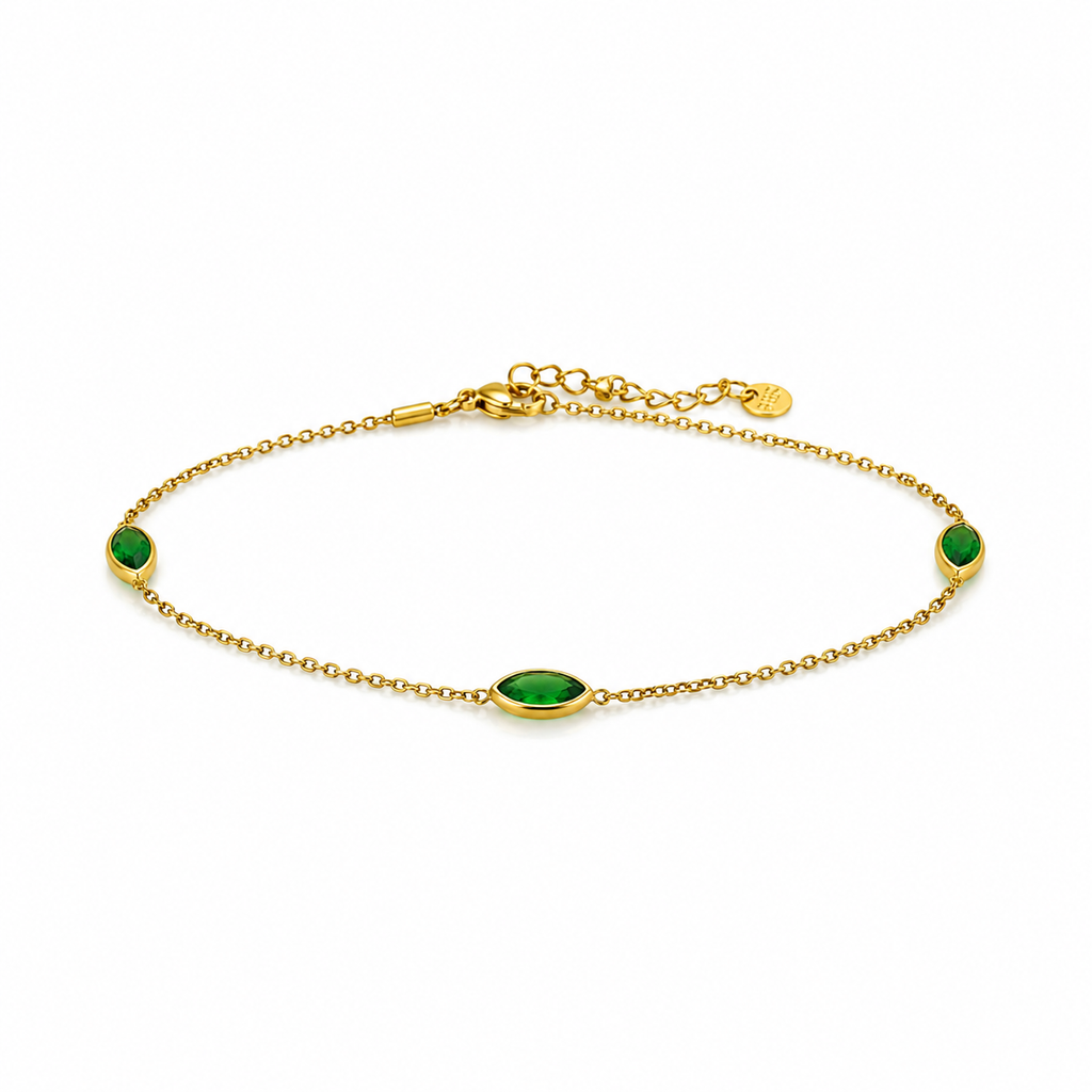 Gold bracelet with green gemstones