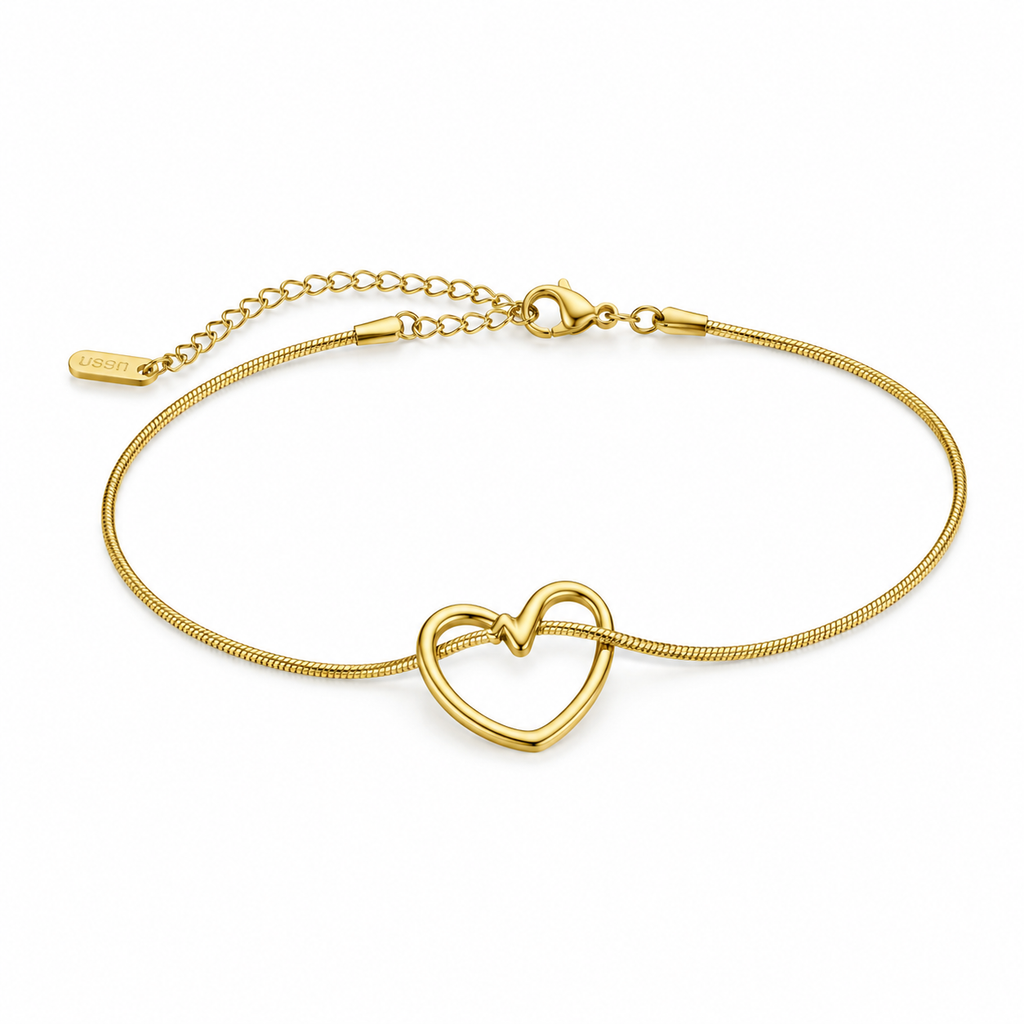Gold bracelet with heart centerpiece